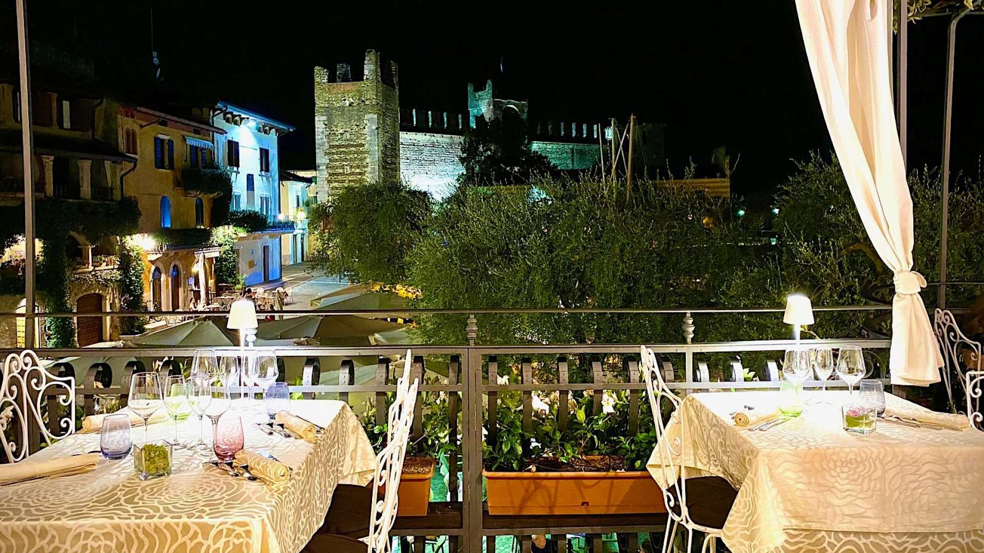 The restaurant terrace at night, castle floodlit